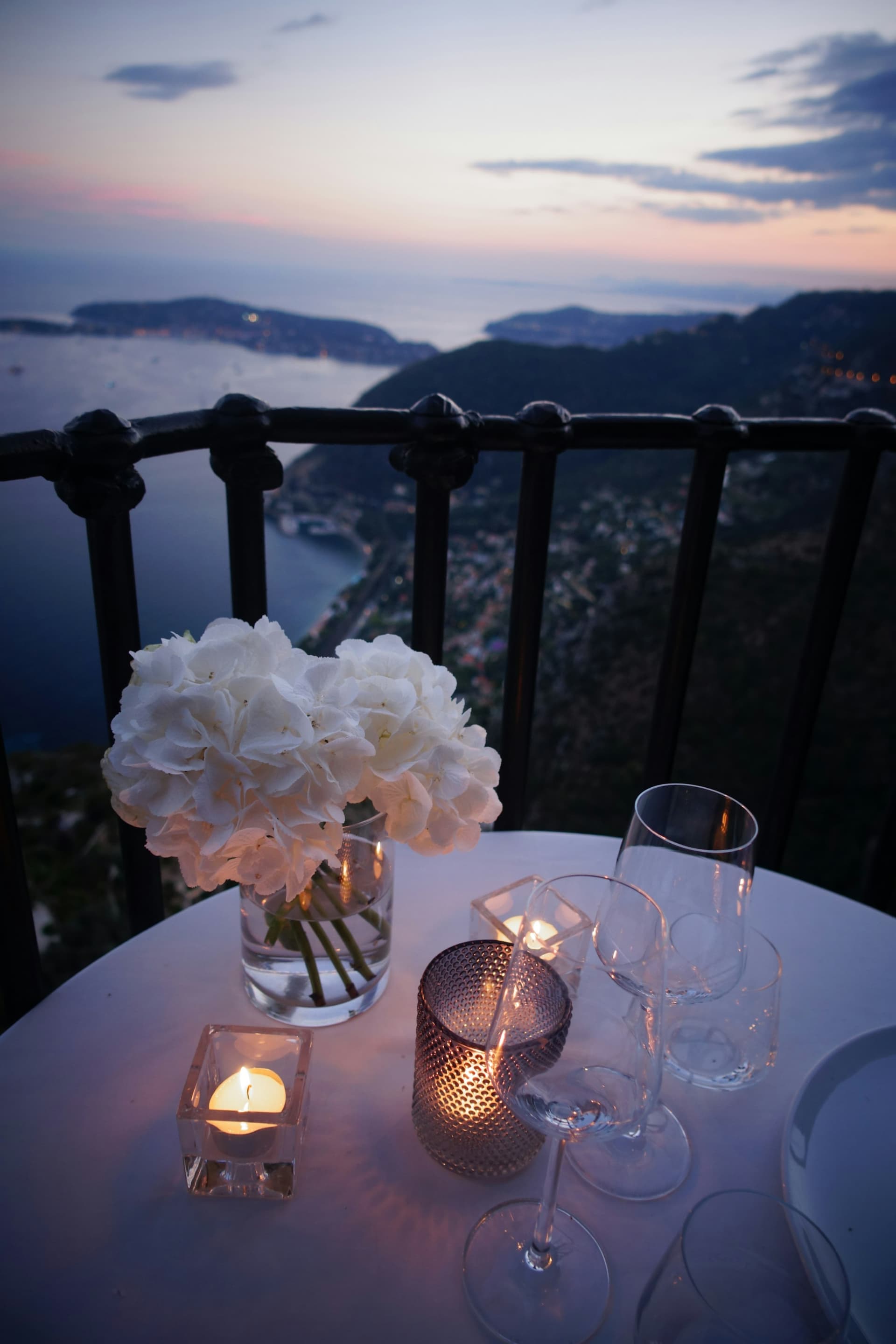 Flowers, candles and a view at dusk