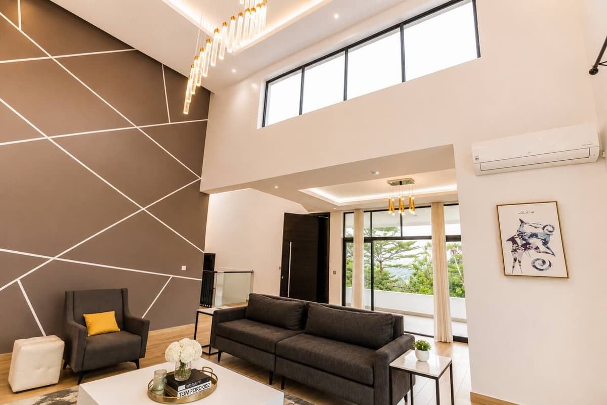 The double-height living room at Urugwiro, with tall windows onto the garden, Kacyiru