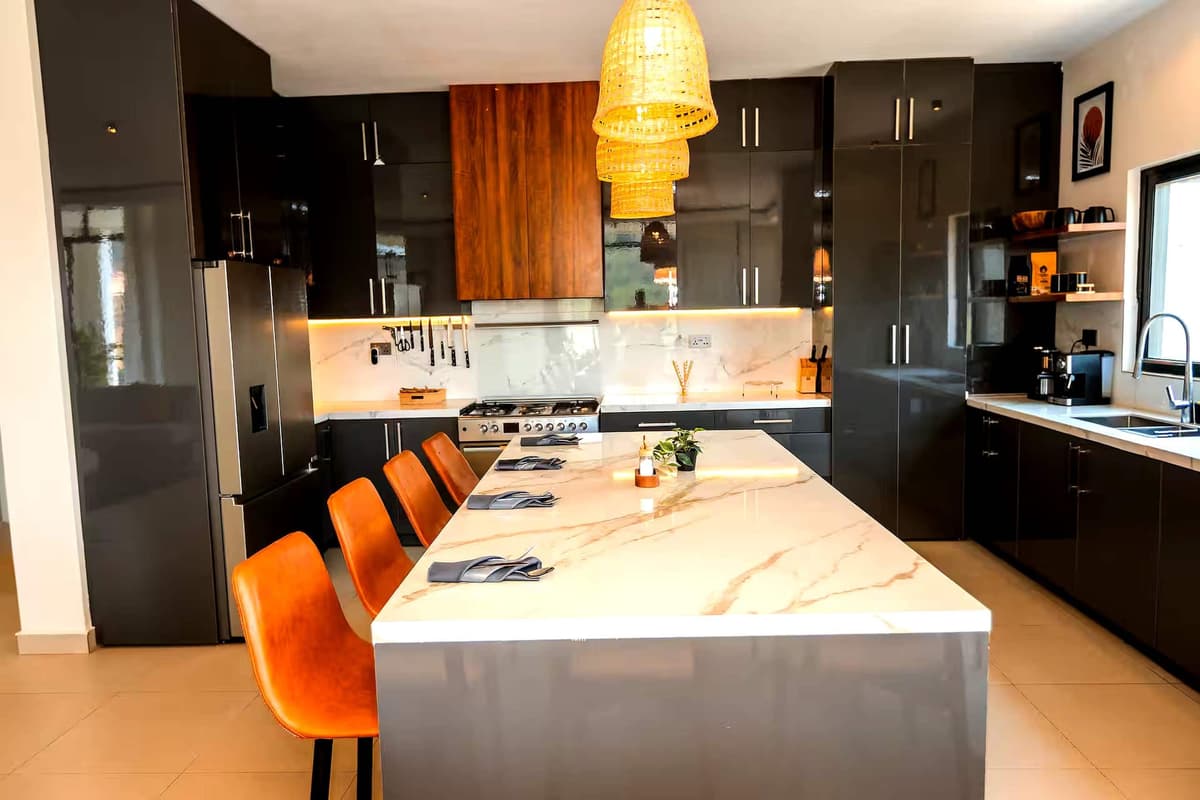 The kitchen, with a waterfall marble island. Amahoro, Kibagabaga.